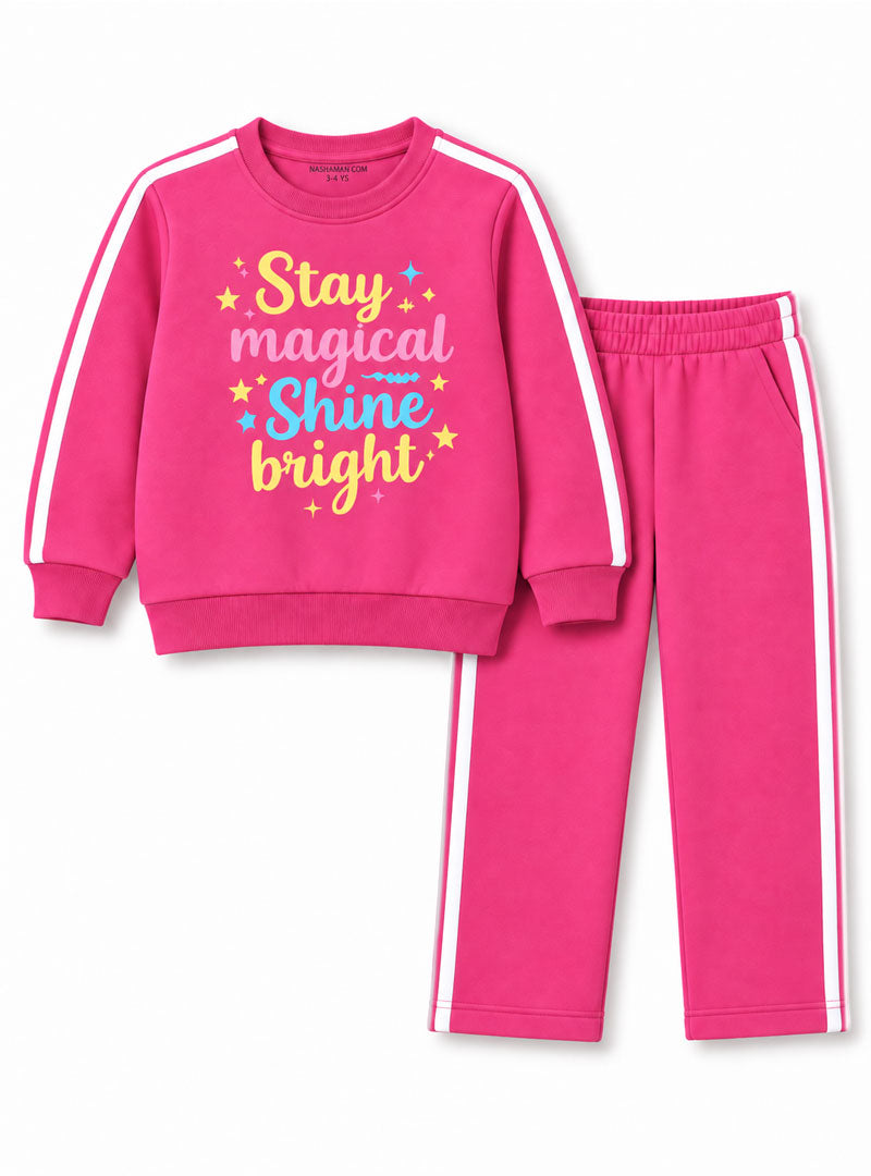 Girl wearing pink Stay Magical Shine Bright winter tracksuit set